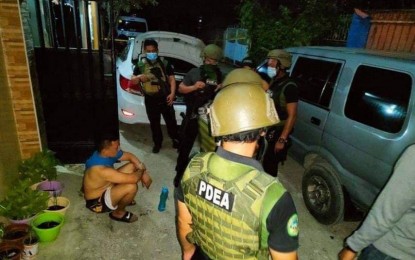 <p><strong>BUSTED.</strong> Members of the Philippine National Police Integrity Monitoring Enforcement Group arrest Pat. Saidamin Bonsalagan Bagul in a drug buy-bust operation in Iligan City on Saturday night (May 29, 2021). The suspect is assigned at the1st Provincial Mobile Force Company of the Lanao del Norte Police Provincial Office.<em> (Photo courtesy of PNP-PIO)</em></p>