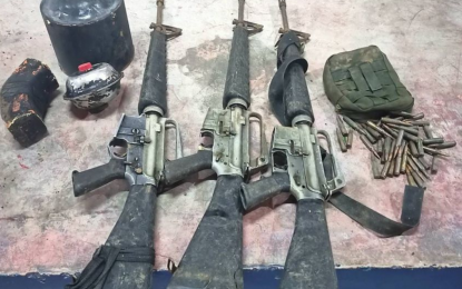 <p><strong>REBEL ARMS RECOVERED.</strong> The firearms and explosives unearthed by government forces after a former NPA fighter guided them to the site where these were buried in Makilala, North Cotabato. The war materiel included three M16 rifles, three improvised explosive devices, three anti-personnel landmines, and ammunition. <em>(Photo courtesy of 39IB)</em></p>