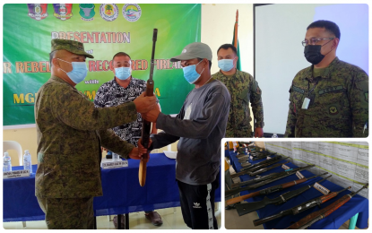 <p><strong>A BETTER LIFE.</strong> One of the 21 combatants of the New People’s Army surrenders to Brigadier Gen. Eduardo Gubat (left), the Army’s 603rd Infantry Brigade commander, in Lebak, Sultan Kudarat on Tuesday morning (June 1, 2021). The surrenderers initially received financial aid and food for the firearms (inset) they have surrendered. <em>(Photo courtesy of 603Bde) </em></p>