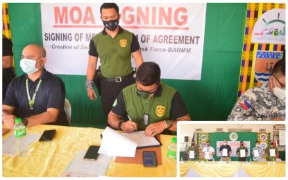 <p><strong>ANTI-DRUG SEAPORT TASK FORCE.</strong> PDEA-BARMM Director Juvenal Azurin (seated center) inks a memorandum of agreement with partner agencies for the establishment of the Seaport Interdiction Task Force (SITF) in the region in a ceremony held at the Polloc port management office on May 25, 2021. The PDEA-led SITF (inset) is mandated to effectively curb the shipment, delivery, and transport of illegal drugs at BARMM ports.<em> (Photo courtesy of PDEA-BARMM)</em></p>