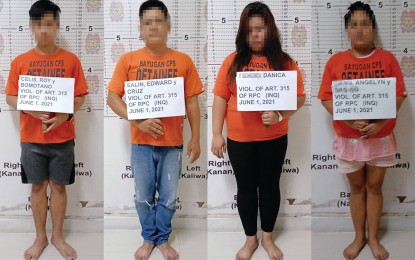 <p><span style="line-height: 1.5;"><strong>INVESTMENT SCAM RECRUITERS</strong>. Police operatives arrest four suspected recruiters of an investment group that operates in Agusan del Sur and Butuan City on Tuesday (June 1, 2021). The entrapment operation was conducted inside a fast-food chain in Bayugan City.<em> (Photo courtesy of PRO-13 Information Office)</em></span></p>