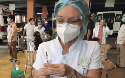<p><strong style="line-height: 1.5;">SPUTNIK V VAX</strong><span style="line-height: 1.5;">. File photo shows a nurse preparing a dose of a Covid-19 vaccine to be administered to a medical front-liner during the initial rollout of mass vaccination in Cebu last March. DOH-7 chief pathologist Dr. Mary Jean Loreche said at least 300 doses of Sputnik V that arrived in Cebu on Wednesday (June 2, 2021) will be given to first dose vaccinees under the A1 to A3 priority groups<em>. (PNA file photo by John Rey Saavedra)</em></span></p>