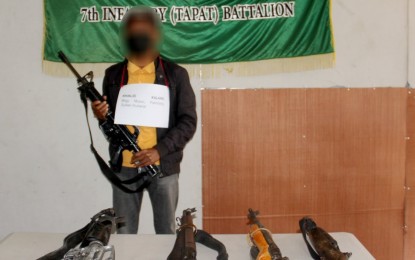 <p><strong>BACK TO NORMAL.</strong> Former Dawlah Islamiya subleader Khalid Kalaing holds one of the five firearms he yielded to the military during his surrender on Wednesday afternoon (June 2, 2021) to the Army’s 7th Infantry Battalion in Sultan Kudarat province. The surrenderer said he wants to again live a normal life with his family. <em>(Photo courtesy of 7IB)</em></p>