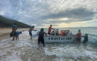 <p><strong>RESCUED</strong>. Coast guards in Ilocos Norte on Friday (June 4, 2021) rescue 12 stranded students in Badoc island. The students went to the island on Thursday but failed to return back home due to high waves. (<em>Photo courtesy of PCG Ilocos Norte</em>) </p>