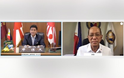 <p><strong>STRONGER ALLIANCE.</strong> Defense Secretary Delfin Lorenzana (right) and Japanese Defense Minister Nobuo Kishi (left) discuss security issues and concerns in a video conference on Wednesday (June 2, 2021). Both officials agreed to intensify defense cooperation between Manila and Tokyo. <em>(Photo courtesy of DND)</em></p>
