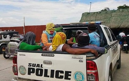 <p><strong>ILLEGAL FISHING</strong>. Police arrests seven fishermen (in photo) for alleged illegal fishing activity in Sual town in Pangasinan on Saturday (June 5, 2021). They were caught fishing using prohibited nets and equipment along the territorial waters of Barangay Baybay Norte. <em>(Photo courtesy Alexander James Navarro of Aksyon Radyo Pangasinan)</em></p>