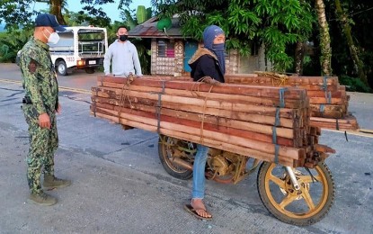 <p><strong>CRACKDOWN VS. ILLEGAL LOGGING.</strong> Various police stations in Surigao del Sur arrest six persons and confiscate PHP30,978 worth of illegally-cut lumber products on Sunday (June 6, 2021). In Cantilan town, local police arrested Jimson D. Sandaya, 26 for transporting 240 board feet of Lawaan lumber products. <em>(Photo courtesy of PRO-13 Information Office)</em></p>