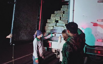 <p><strong>HOT LOGS.</strong> Butuan City Police personnel intercept a truck carrying about 6,500 board ft. of illegally-cut lawaan lumber worth PHP227,000 in Barangay Ampayon on Monday (June 7, 2021). Authorities arrested Bryan Maycong Lovinarion, 29, the driver of the truck, and his helper, Jear Madelo Halop, 22, for failing to present pertinent documents on the lumber products. <em>(Photo courtesy of BCPO Information Office)</em></p>