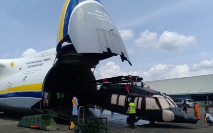 <p><strong>MORE BLACK HAWK CHOPPERS.</strong> One of the five Black Hawk helicopters that arrived in the country is unloaded from a transport aircraft at the Clark Air Base in Pampanga on Monday (June 7, 2021). These are part of the 16 helicopters for the Philippine Air Force acquired by the country from Poland through a government-to-government transaction. <em>(Photo courtesy of Philippine Air Force)</em></p>