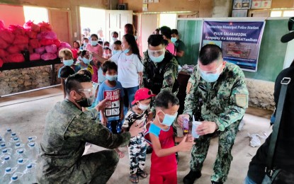 <p><strong>AETA RELIEF.</strong> Food, clothes, and health kits are distributed, along with a feeding program and free haircut service, to an Aeta community in Barangay Del Rosario, Buenavista, Quezon on Saturday (June 5, 2021). The activity was a joint effort of the Army, Calabarzon police and village officials headed by chair Julio Hermina. <em>(Photo courtesy of Buenavista Pulis Facebook)</em></p>
