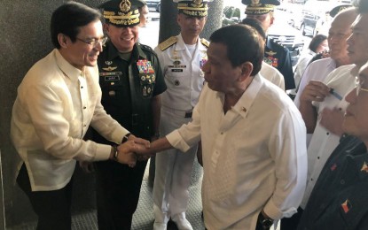 <p><strong>NOT ANTI-GOV’T.</strong> Manila Mayor Isko Moreno greets President Rodrigo Duterte during the Presidential Silent Drill Competition at the Quirino Grandstand on December 19, 2019. On Wednesday night (June 9, 2021), the mayor said he is not anti-government and slammed a fake conversation where the city’s information officer allegedly said the President no longer enjoys public support.<em> (Photo courtesy of Manila-PIO)</em></p>