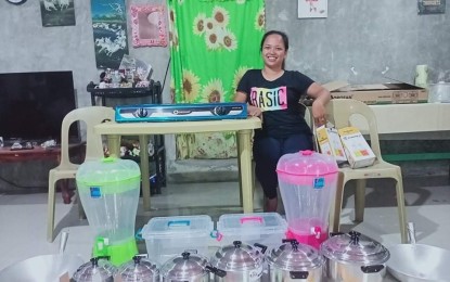 <p><strong>BLESSED.</strong> Food entrepreneur Lynette Cascayan shows off her new kitchen wares in a Facebook post on Friday (June 11, 2021). The Department of Trade and Industry Ilocos Norte gave her a starter kit as part of its Livelihood Seeding Program for rural communities. <em>(Photo courtesy of Lynette Jane Cascayan Facebook)</em></p>