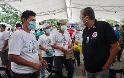 <p><strong>DIALOGUE.</strong> Department of Transportation (DOTr) Secretary Arthur Tugade (right) talks with jeepney drivers in Dagupan City on Thursday (June 10, 2021). Tugade held dialogues with transport groups in Pangasinan informing them as well of available programs of the national government for them. <em>(Photo courtesy of DOTr Facebook page)</em></p>