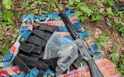 <p><strong>EVIDENCE.</strong> Firearms and ammunition left behind by communist terrorist groups are found by the police in Barangay Anas, Masbate where Kieth and Nolven Absalon died on Sunday (June 6, 2021). The Communist Party of the Philippines-New People's Army admitted their members planted the anti-personnel mine that caused the instant death of the cousins and the wounding of their 16-year-old companion. <em>(Photo courtesy of Police Community Affairs and Development Group Bicol Facebook)</em></p>