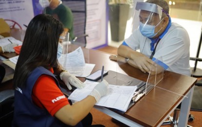 <p><strong>MALL SITE.</strong> A Philippine ID registrant completes his Step 2 (biometrics) registration at SM Southmall in Las Piñas in this June 2021 photo. For a more convenient process, the Philippine Statistics Authority, lead implementer of the Philippine Identification System, has partnered with the private sector in setting up registration centers. <em>(Photo courtesy of SM)</em></p>