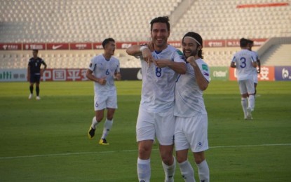 <p><strong>3-0 FOR THE AZKALS</strong>. Angel Guirado (No. 8) and Mike Ott celebrate after the former scored a goal for the Philippine Azkals against Guam in the second round of the joint FIFA World Cup and AFC Asian Cup Qualifiers at the Sharjah Stadium on Friday (June 11, 2021). The Philippine Azkals moved closer to securing a place in the third round of the AFC qualifiers with their 3-0 win over Guam. <em>(Photo courtesy of PFF)</em></p>