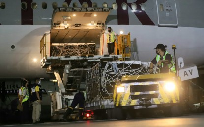 <p><strong>SPUTNIK V LANDS IN MANILA</strong>. A total of 100,000 doses of the Sputnik V vaccine against Covid-19 are offloaded from a Qatar Airways aircraft at the Ninoy Aquino International Airport Terminal 3 in Pasay City on Friday night (June 11, 2021). The vaccines were transported to the PharmaServ Warehouse in Marikina City for storage. <em>(PNA photo by Robert Oswald P. Alfiler)</em></p>