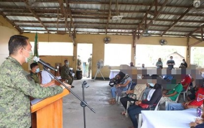 <p><strong>‘SAMBAYANAN’ LAUNCHING.</strong> Lt. Col. Reandrew Rubio, commander of the 91st Infantry Battalion delivers his message during the launching of the Sentrong Alyansa ng Mamamayan Para sa Bayan (SAMBAYANAN) in Aurora province on Saturday (June 12, 2021). SAMBAYANAN is an organization composed of former members of the New People’s Army (NPA) who abandoned their allegiance to the underground communist movement.  <em>(PNA photo by Jason de Asis)</em></p>