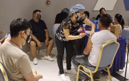 <p><strong>COVID-19 VACCINATION</strong>. Residents of Bacolod City get inoculated against Covid-19 at the vaccination center inside the SM City Bacolod on June 11, 2021. Some 42,173 doses were already administered by the city government from March 5 to June 11, data released by the Emergency Operations Center Task Force on Monday (June 14, 2021) showed.  <em>(Photo courtesy of Bacolod City PIO)</em></p>