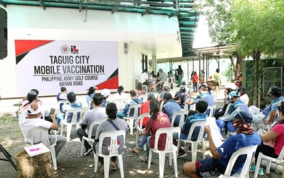 <p><strong>MOBILE VAX.</strong> Taguig’s vaccination bus went to the Army Golf Club along Bayani Road on June 11, 2021. The bus can accommodate 200 a day and will be stationed in its designated area for two to three days. <em>(Photo courtesy of Taguig-PIO)</em></p>