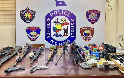 <p><strong>ARMS HAUL.</strong> High-powered firearms seized from big-time gunrunner John Christian Bautista are presented at the Northern Police District on Wednesday (June 16, 2021). PNP chief Gen. Guillermo Eleazar has ordered a probe to determine whether Bautista is part of a gunrunning syndicate. <em>(Photo courtesy of PNP)</em></p>