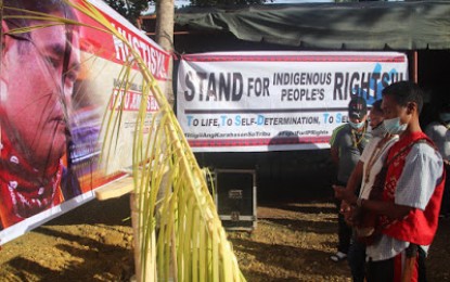<p>Manobo tribe members in Lianga town, Surigao del Sur pay tribute to Datu Hawudon Jumar Bucales, IP Mandatory Representative of LiangaI in this October 31, 2020 photo. Bucales was killed by New People's Army guerrillas on Oct. 4 last year. (<em>EastMinCom photo</em>)</p>
<p> </p>
<p> </p>
<div> </div>