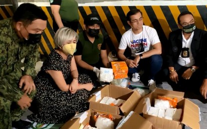 <p><strong>CONTRABAND.</strong> Manila Mayor Isko Moreno (4th from left) and Vice Mayor Honey Lacuna-Pangan (2nd from left) inspect the 38 kilos of shabu worth PHP258.4 million seized in a condominium in Malate, Manila on Monday (June 21, 2021). A male Chinese national was arrested. <em>(Screengrab by Marita Moaje)</em></p>