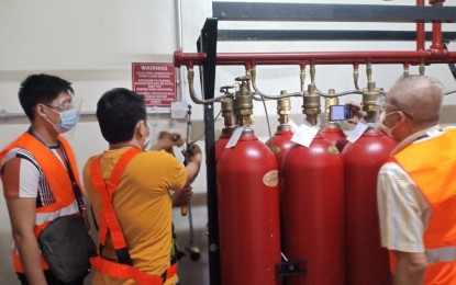 <p><strong>TESTING</strong>. Personnel of the Metro Rail Transit Line 3 (MRT-3) test the newly refilled carbon dioxide (CO2) tanks on Tuesday (June 22, 2021). A well-functioning CO2 room is a critical part of the fire detection and alarm system to ensure accidents-free line operation and the safety of the passengers. <em>(Photo courtesy of MRT-3)</em></p>