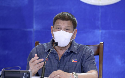 <p><strong>PREVENT DISASTER</strong>. President Rodrigo Roa Duterte talks to the people after holding a meeting with the Inter-Agency Task Force on the Emerging Infectious Diseases (IATF-EID) core members at the Arcadia Active Lifestyle Center in Matina, Davao City on Monday (June 21, 2021). Duterte said the small inconvenience of wearing face shields is a small price to pay to prevent impending “disaster” caused by new coronavirus strains. <em>(Presidential photo by Simeon Celi)</em></p>