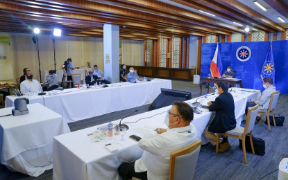 <p><strong>QUARANTINE EXPENSES</strong>. President Rodrigo Roa Duterte presides over a meeting with the Inter-Agency Task Force on the Emerging Infectious Diseases (IATF-EID) core members prior to his talk to the people at the Arcadia Active Lifestyle Center in Matina, Davao City on Monday (June 21, 2021). Duterte suggested using the unobligated funds under the Bayanihan to Recover as One Act (Bayanihan 2) to pay for facility-based quarantine of all returning overseas Filipinos.<em> (Presidential photo by Joey Dalumpines)</em></p>