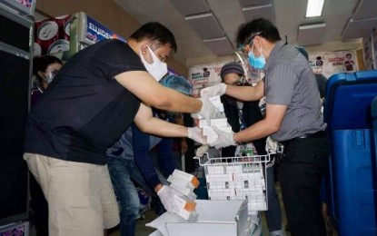 <p><strong>MORE VACCINES FOR BACOLOD</strong>. Dr. Edwin Miraflor Jr. (right), officer-in-charge of Bacolod City Health Office, and Dr. Chris Sorongon (left), medical deputy of the Emergency Operations Center, lead the inventory of the 15,000 vials of Sinovac’s CoronaVac jabs shipped by the national government on Wednesday (June 23, 2021). Mayor Evelio Leonardia said the arrival of additional vaccines will accelerate the momentum of the city’s vaccination program against Covid-19.<em> (Photo courtesy of Bacolod City PIO)</em></p>