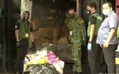 <p><strong>DESTROYED.</strong> Philippine Drug Enforcement Agency Director General Wilkins Villanueva (left) and Philippine National Police (PNP) chief, Gen. Guillermo Eleazar (3rd from right) lead the destruction of some PHP1.2 billion worth of illegal drugs in Cavite on Wednesday (June 23, 2021). The illegal drugs were destroyed through thermal decomposition. <em>(Screengrab from RTVM)</em></p>
