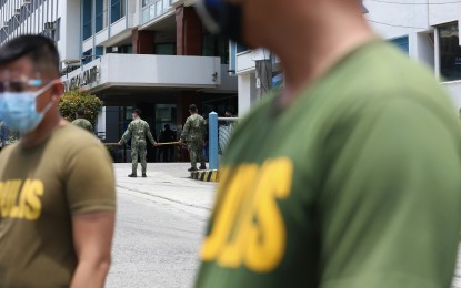 <p><strong>SECURITY FOR PNOY</strong>. Police officers use rattan sticks to secure the premises of the Capitol Medical Center in Quezon City where former president Benigno "Noynoy" Aquino III was brought Thursday morning (June 24, 2021). An official statement of the family read by Pinky Aquino Abelada, one of the four surviving sisters, said the 61-year-old former leader died of renal failure as a result of diabetes. <em>(PNA photo by Robert Oswald P. Alfiler)</em></p>