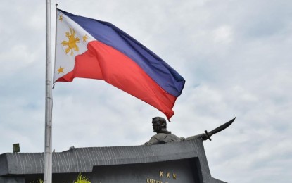 <p><strong>MOURNING.</strong> The Philippine flag at the Kartilya ng Katipunan monument in Manila flies at half-mast on Thursday (June 24, 2021). As the capital city was celebrating its 450th foundation anniversary, news came out that former president Noynoy Aquino has passed away.<em> (Photo courtesy of Manila-PIO)</em></p>
