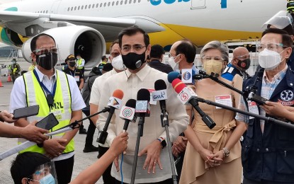 <p><strong>BEST GIFT.</strong> Manila Mayor Francisco 'Isko Moreno' Domagoso speaks to reporters in a press briefing on the sidelines of the arrival of the two million Sinovac Covid-19 jabs at the NAIA Terminal 2 on Thursday (June 24, 2021). He said the arrival of the jabs is the best gift to Manila residents in celebration of the city's 450th founding anniversary. <em>(PNA photo by Joey Razon)</em></p>