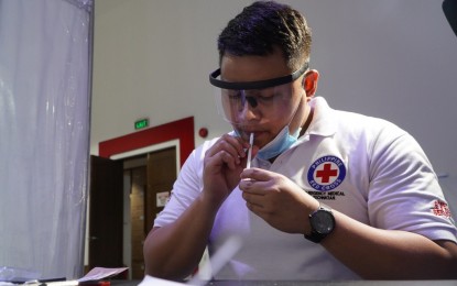 <p><br /><strong>SALIVA TEST.</strong> The Philippine Red Cross’ saliva reverse transcription polymerase chain reaction test is now included in all official laboratory results done in the Philippines. The PRC is the only organization approved by the Department of Health to conduct saliva RT-PCR tests in the country. <em>(Contributed photo)</em></p>