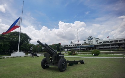 <p><strong>FINAL RESPECTS.</strong> The Philippine flag at the AFP headquarters in Camp Aguinaldo, Quezon City is flown in half-mast on Friday (June 25, 2021) to mourn the passing of former president Benigno Simeon 'Noynoy' Aquino III. Military troops rendered traditional gun salute in various camps to honor their former commander-in-chief.<em> (Photo courtesy of AFP Public Affairs Office)</em></p>