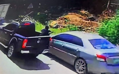 <p><strong>DRIVE-BY KILLING.</strong> A video grab from a closed-circuit television camera shows a gunman shooting at Ali Gampong, chairperson of Barangay Tiguma in Pagadian City, Zamboanga del Sur on Thursday (June 24, 2021). The police launched a probe to unmask the gunman and his accomplice in the attack. <em>(Video grab photo by Leah D. Agonoy)</em></p>