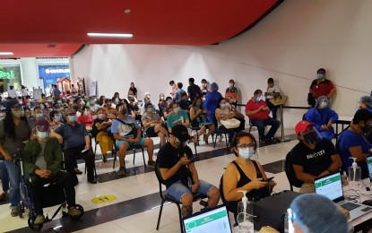 <p><strong>MALL JABS.</strong> Residents queue in one of three malls that serve as jabs sites in Cagayan de Oro City in this June 2021 photo. A fourth mall will soon make available its cinema area to vaccinate more residents from uptown areas and hinterland villages. <em>(Photo courtesy of CDO-CIO)</em></p>