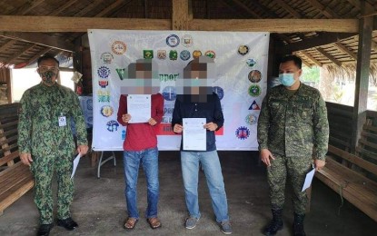 <p><strong>SURRENDERED</strong>. Two former members of the dismantled terror group of the Communist Party of the Philippines-New People’s Army (CPP-NPA) in Aurora surrendered to government troops on Friday (June 25, 2021). The former rebels were identified as “Ka Max” and “Ka Dodong,” members of Komiteng Larangang Guerilla Sierra Madre (KLG-SM) of the NPA’s Sentro De Gabridad (SDG) Platoon in Aurora. <em>(Photo courtesy of the Army's 91IB)</em></p>
