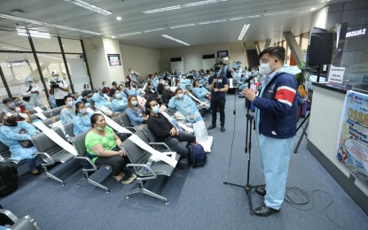 <p><strong>NEXT STEP.</strong> Repatriates from the Gulf states listen to arrival protocols at the Ninoy Aquino International Airport in Pasay City on Friday (June 25, 2021). Home through government efforts, all 301 repatriates were given PHP10,000 each. <em>(Photo courtesy of PCOO)</em></p>