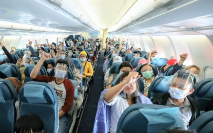 <p><strong>HOME AT LAST.</strong> The government facilitates the repatriation of 301 overseas Filipino workers who arrived from the Gulf states on Friday (June 25, 2021). Each repatriate received PHP10,000 cash.<em> (Photo courtesy of PCOO)</em></p>