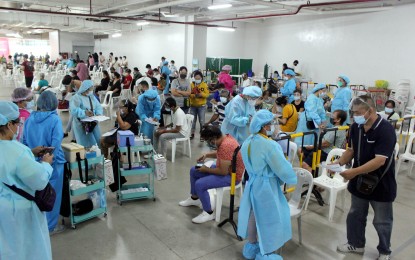 <p><strong>A1-A3 CATEGORIES</strong>. Residents line up for the first dose of Sinovac vaccine at the second floor of Robinsons Place mall along Emilio Aguinaldo Highway in Sitio Palapala, Dasmariñas City, Cavite on Tuesday (June 29, 2021). Around 500 residents under A1 to A3 categories, or the medical front-liners, senior citizens, and persons with comorbidities, were inoculated during the vaccination rollout in the area. <em>(PNA photo by Gil Calinga)</em></p>