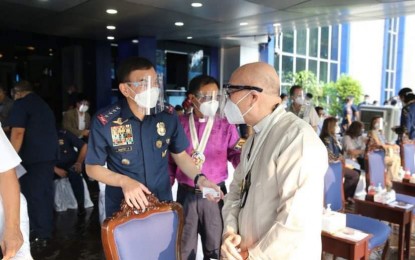 <p><strong>COLLABORATION.</strong> Philippine National Police chief Gen. Guillermo Eleazar (left) confers with a church leader at Camp Crame in Quezon City on Monday (June 28, 2021). Various religious organizations will help PNP members address their psychospiritual needs.<em> (Photo courtesy of PNP)</em></p>