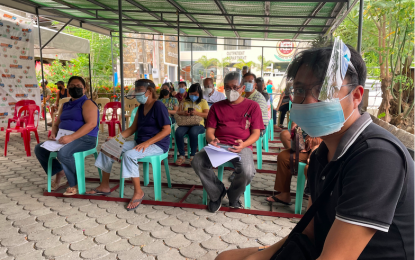 <p><strong>MASS JABS</strong>. Vaccinees from the A4 category line up to get their first dose of Covid-19 vaccine at the Karmelli Hospital in Laoag City on Tuesday (June 29, 2021). According to the Provincial Health Office, over 33,000 residents from A1, A2, and A3 categories have been inoculated so far in Ilocos Norte. (<em>PNA photo by Leilanie G. Adriano</em>) </p>