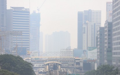 <p><strong>HAZY.</strong> High-rise buildings are barely visible in the Quezon City area on Tuesday (June 29, 2021). The Philippine Institute of Volcanology and Seismology said the haze is not coming from the volcanic smog over the Taal Volcano's caldera but due to other activities like vehicle movements. <em>(PNA photo by Robert Oswald P. Alfiler)</em></p>
