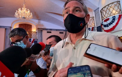 <p><strong>‘SATISFACTORY ARRANGEMENT’.</strong> US Embassy Chargé d’Affaires John Law speaks with the media during the US Independence Day celebrations at the embassy in Manila on Thursday (July 1, 2021). Law said the US is hoping for a 'satisfactory arrangement' with the Philippines for the continuation of the Visiting Forces Agreement. <em>(PNA photo by Joyce Ann L. Rocamora)</em></p>
