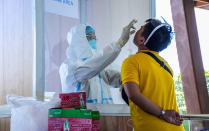 <p><strong>TARGETED TEST.</strong> A worker undergoes an antigen test at the Veranza Mall in General Santos City on June 18, 2021. Local officials said it is one way to prevent the spread of Covid-19, aside from the required wearing of masks and face shields. <em>(Photo courtesy of Gensan-LGU Facebook)</em></p>