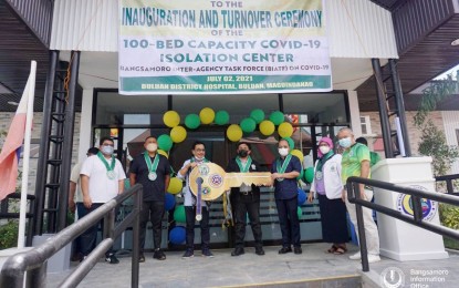 <p><strong>NEW ISOLATION FACILITY</strong>. BARMM health and public works officials inaugurate a 100-bed Covid-19 isolation facility in Buluan, Maguindanao on Friday (July 2, 2021). With the new facility, the BARMM has eight facility projects across the region, two of which are under construction. <em>(Photo courtesy of MOH-BARMM)</em></p>