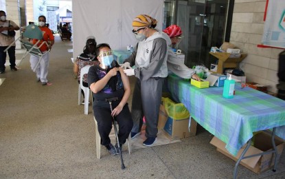 <p><strong>VACCINATED.</strong> A woman receives a Covid-19 shot at the Benguet General Hospital in this undated photo. The hospital on June 17 and 18 inoculated 201 individuals belonging to the priority sectors composed of health care workers, senior citizens, and adults with comorbidities.<em> (Photo courtesy of Benguet-PIO)</em></p>